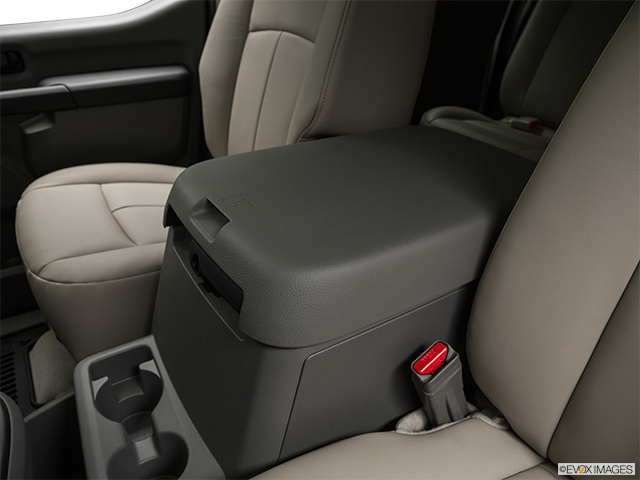 2019 Nissan NV Tourisme | Front center console with closed lid, from driver’s side looking down