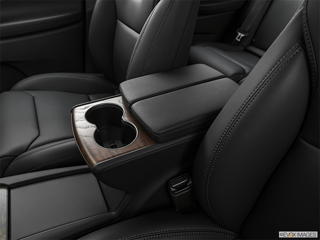 2019 Tesla Model X | Front center console with closed lid, from driver’s side looking down