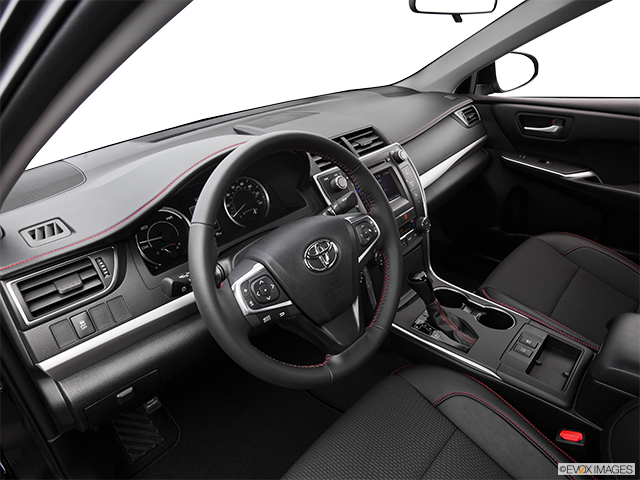 2016 Toyota Camry Hybrid | Interior Hero (driver’s side)