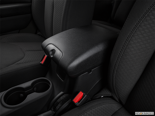 2016 Jeep Wrangler | Front center console with closed lid, from driver’s side looking down