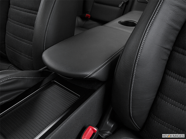 2016 Nissan GT-R | Front center console with closed lid, from driver’s side looking down