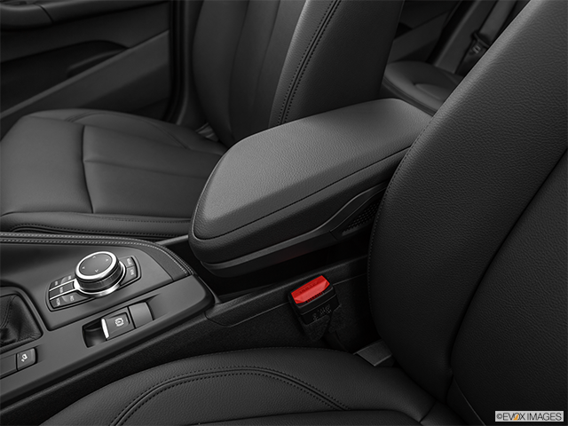 2022 BMW X1 | Front center console with closed lid, from driver’s side looking down