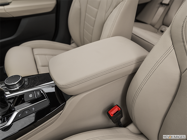 2023 BMW X4 M | Front center console with closed lid, from driver’s side looking down