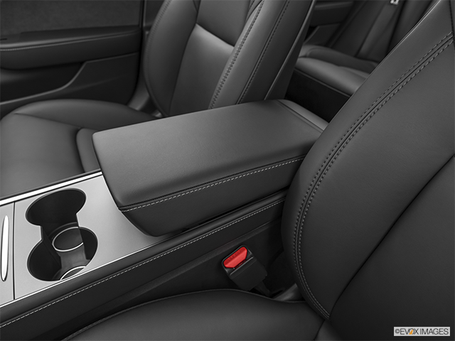 2022 Tesla Model 3 | Front center console with closed lid, from driver’s side looking down