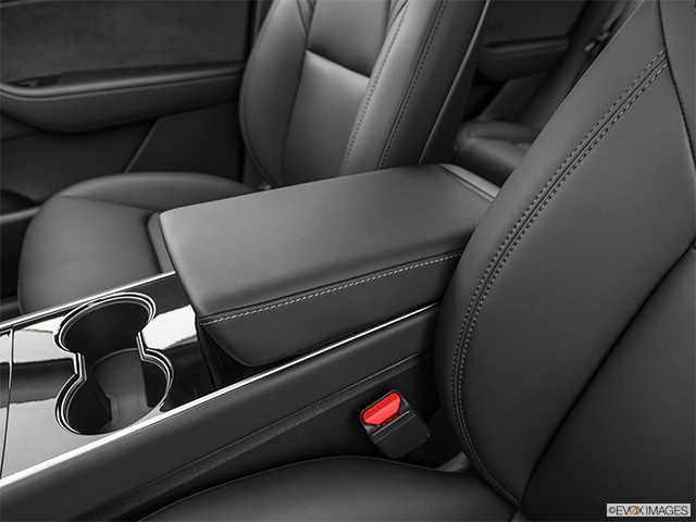 2021 Tesla Model Y | Front center console with closed lid, from driver’s side looking down