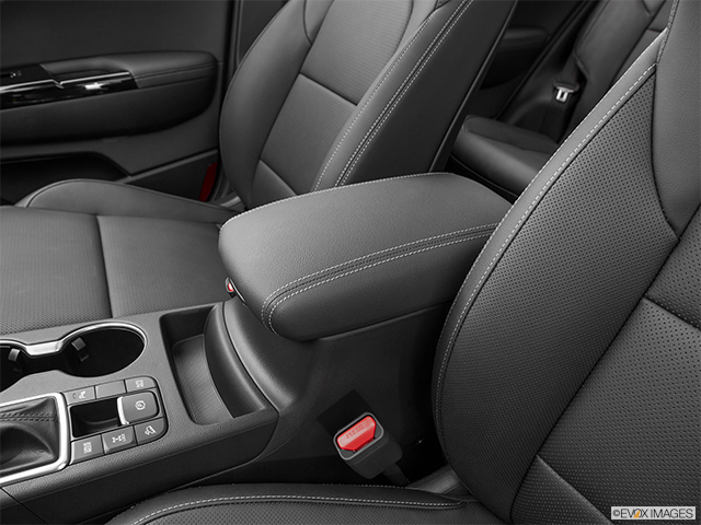 2024 Kia Sportage | Front center console with closed lid, from driver’s side looking down