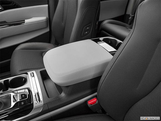 2022 Kia Carnival | Front center console with closed lid, from driver’s side looking down
