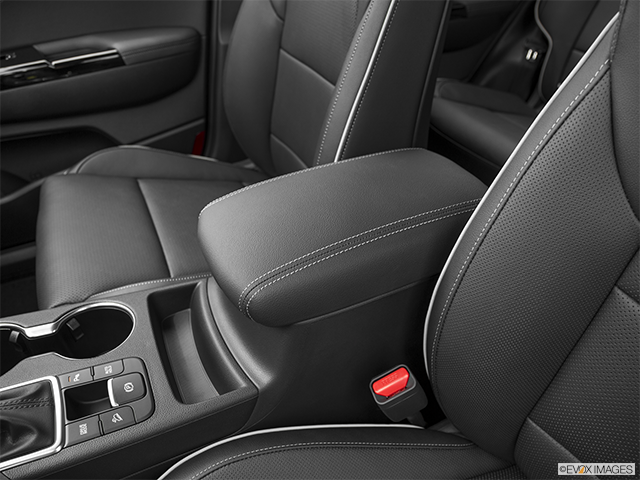 2023 Kia Sportage | Front center console with closed lid, from driver’s side looking down