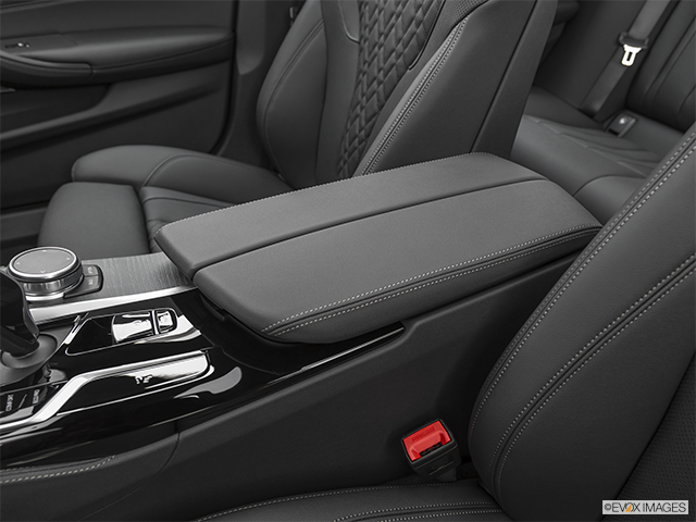 2022 BMW 5 Series | Front center console with closed lid, from driver’s side looking down