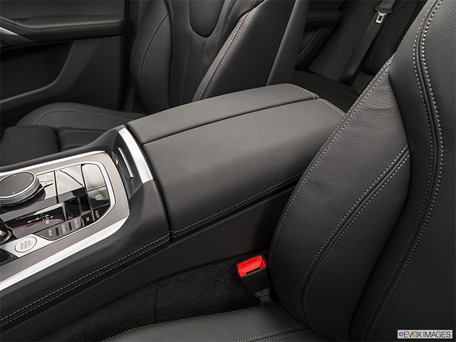 2024 BMW X6 M | Front center console with closed lid, from driver’s side looking down