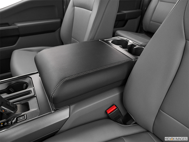 2023 Ford F-150 Lightning | Front center console with closed lid, from driver’s side looking down