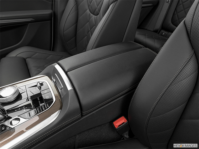 2023 BMW X5 | Front center console with closed lid, from driver’s side looking down