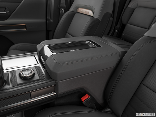 2024 GMC HUMMER EV | Front center console with closed lid, from driver’s side looking down