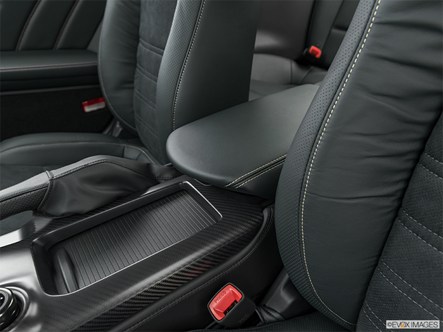 2024 Nissan GT-R | Front center console with closed lid, from driver’s side looking down