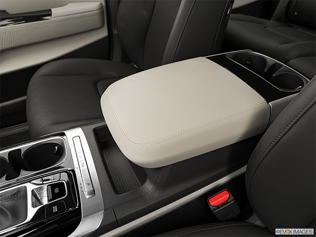 2023 Kia Carnival | Front center console with closed lid, from driver’s side looking down