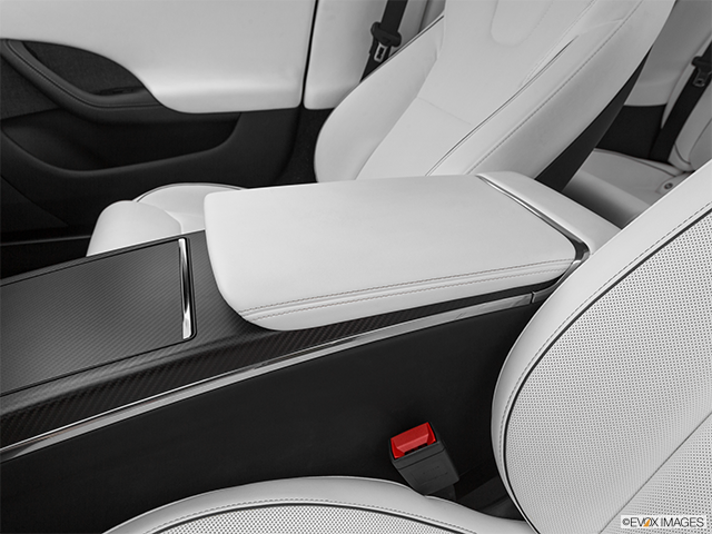 2024 Tesla Model S | Front center console with closed lid, from driver’s side looking down