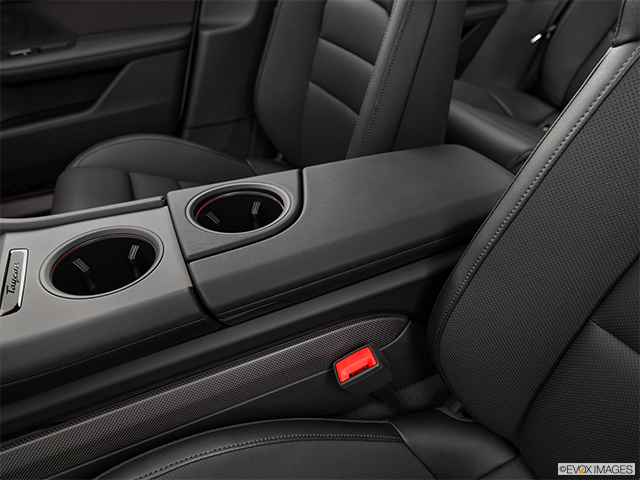 2025 Porsche Taycan | Front center console with closed lid, from driver’s side looking down