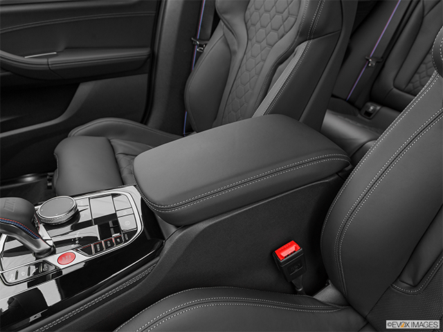 2022 BMW X4 M | Front center console with closed lid, from driver’s side looking down