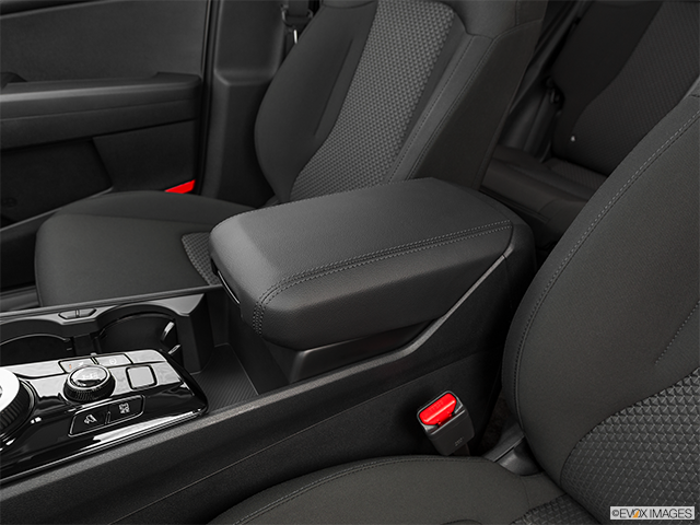 2023 Kia Sportage | Front center console with closed lid, from driver’s side looking down