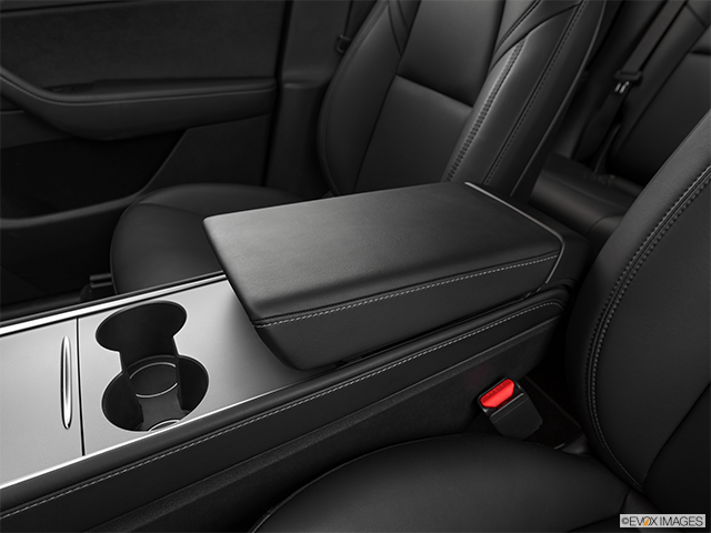 2022 Tesla Model Y | Front center console with closed lid, from driver’s side looking down