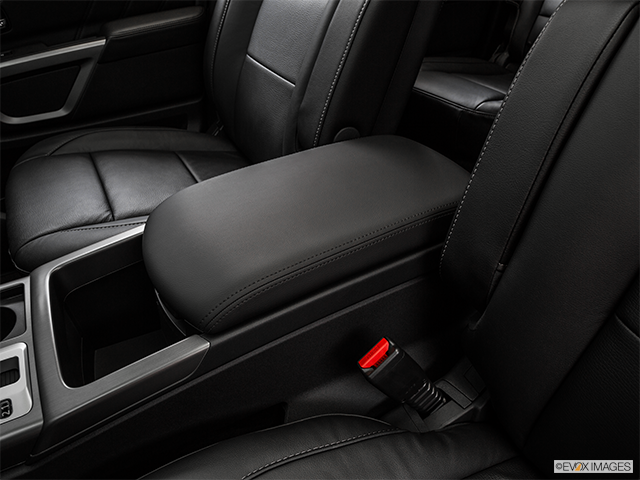 2015 Nissan Armada | Front center console with closed lid, from driver’s side looking down